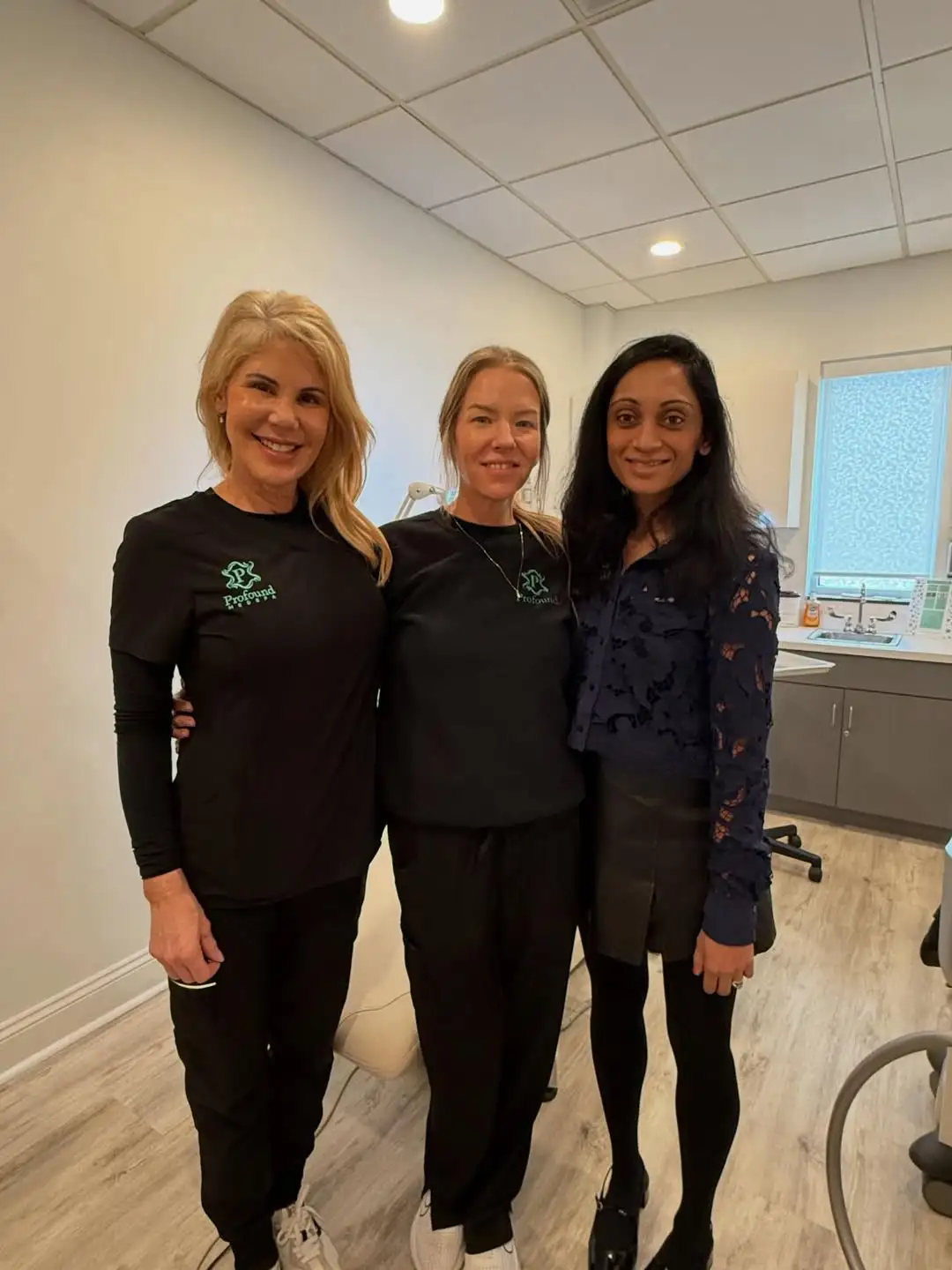 Strella Medical Aesthetics team members posing together inside the Trooper, PA medical spa treatment room.
